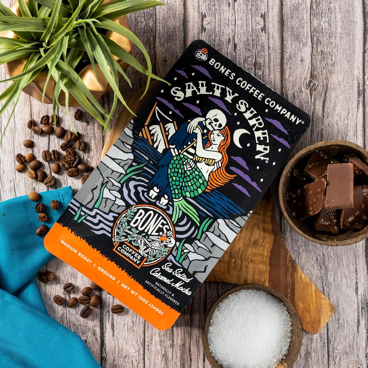 Bones Coffee Company Salty Siren, Sea Salted Caramel Chocolate Flavored Coffee, Medium Roast Low Acid Arabica Beans Compatible with Auto drip and French Press Coffee Maker, 12 Oz Ground